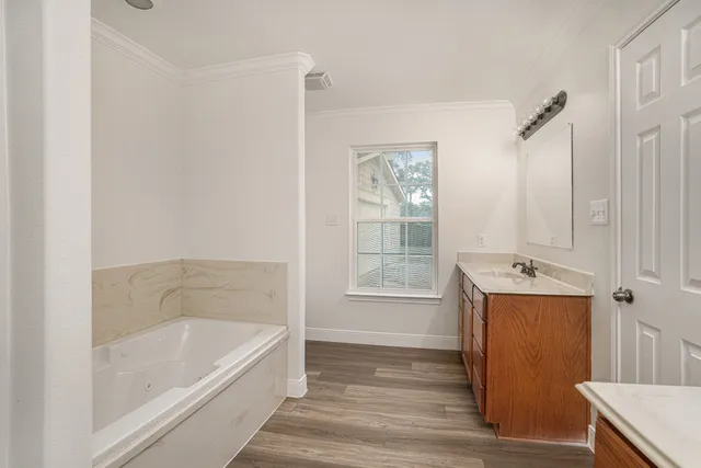 a bathroom with a bathtub and shower
