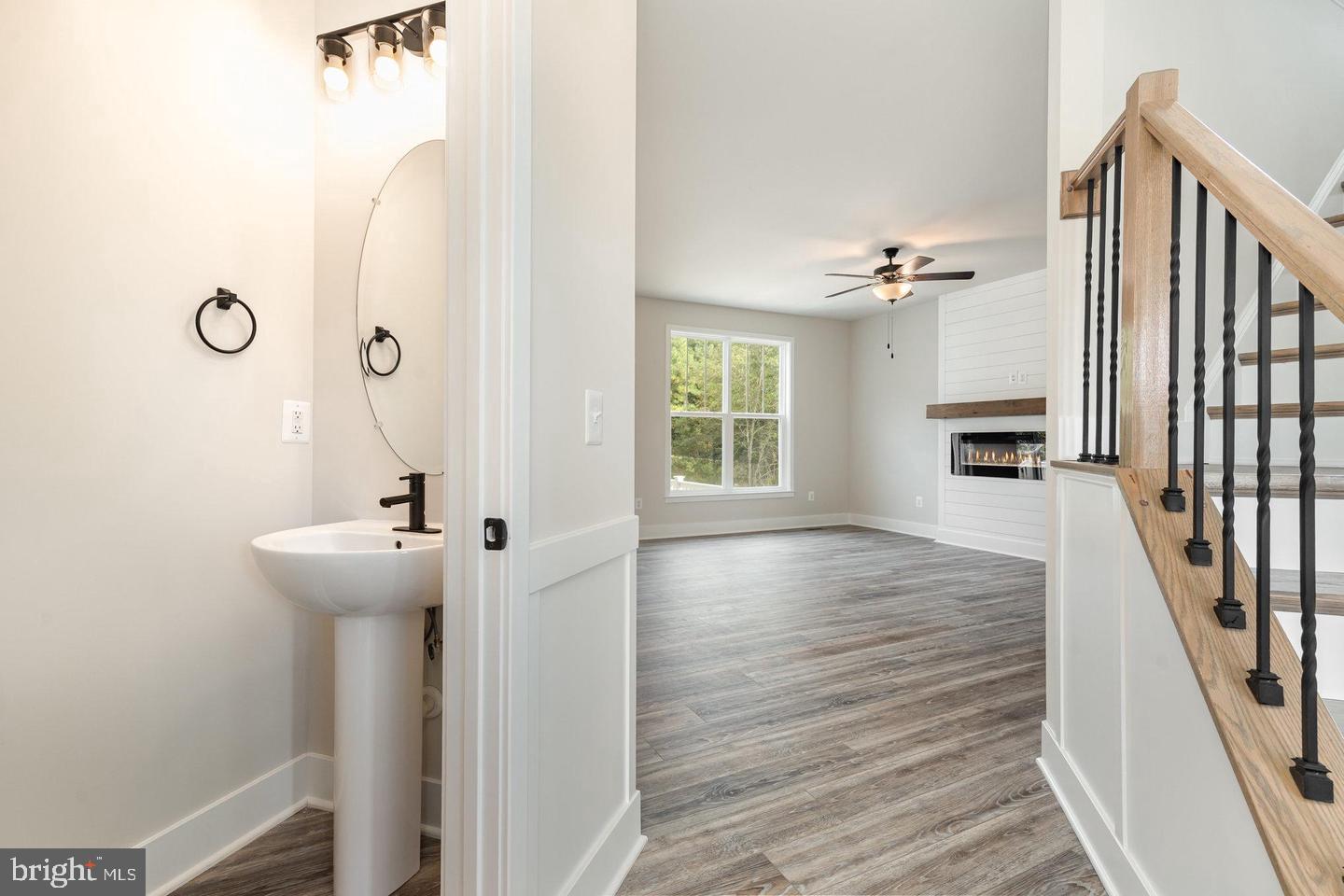 Leading into open concept living/dining/kitchen
