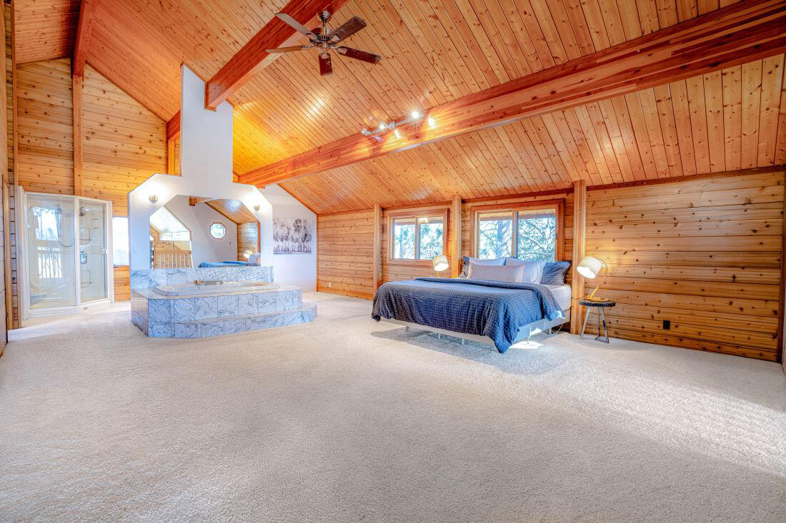 60647 Antler Road Bend, OR 97702 - Photo 23 of 44 a view of a livingroom with furniture and a ceiling fan