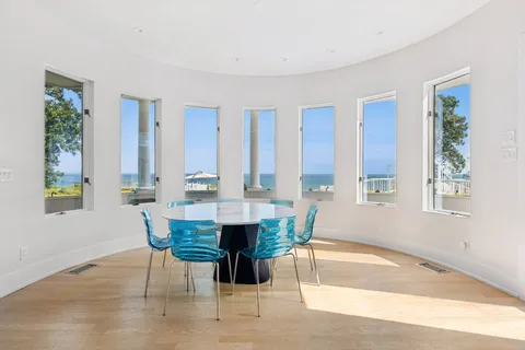 a dining room with furniture and window
