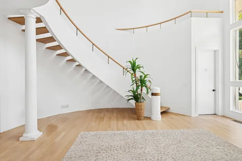 a view of entryway with wooden floor