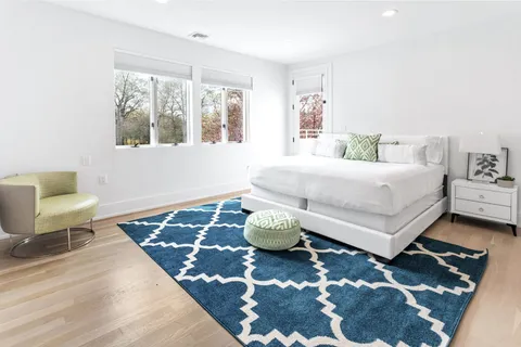 a bedroom with a bed and a couch