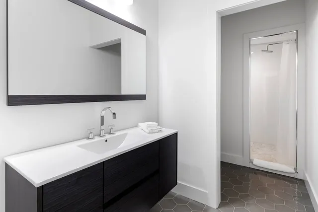 a bathroom with a sink and a mirror