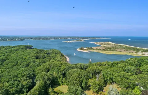 an aerial view of a residential houses with outdoor space