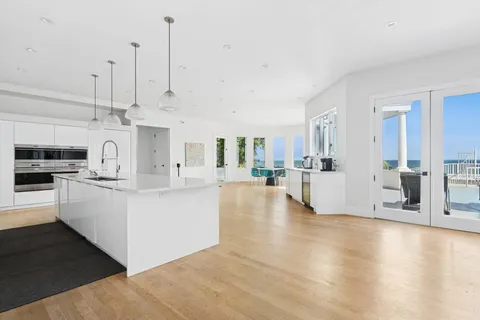 a view of kitchen center island and stainless steel appliances