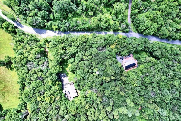 a backyard of a house with lots of green space