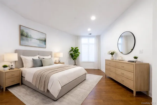 a bedroom with a bed and a dresser