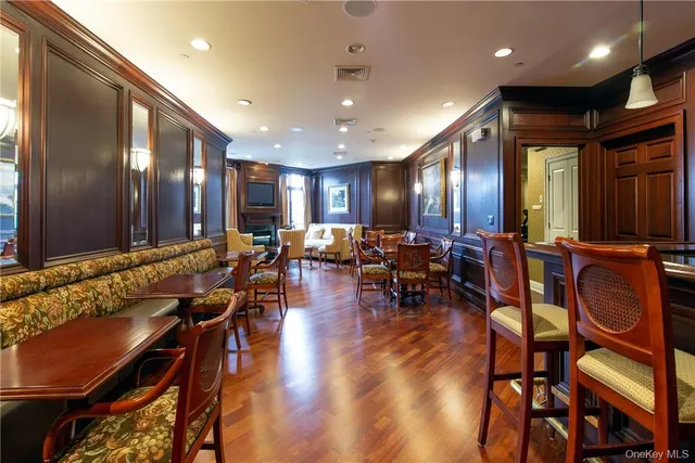 a lobby with furniture and wooden floor