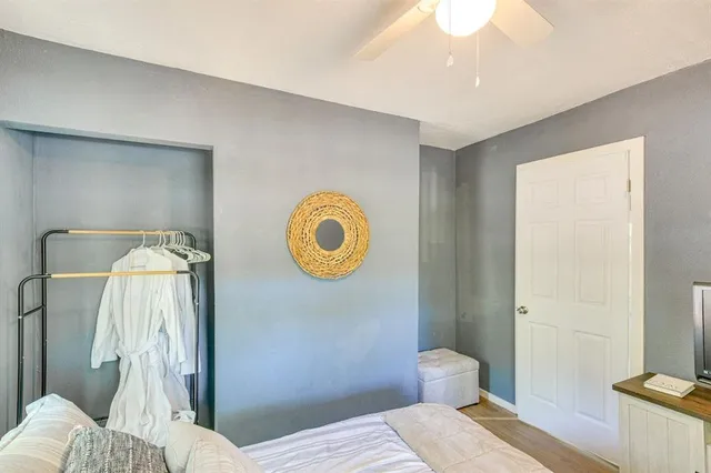 a bedroom with a bed and a window