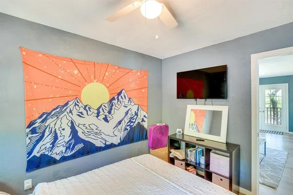 a living room with a flat screen tv and a couch