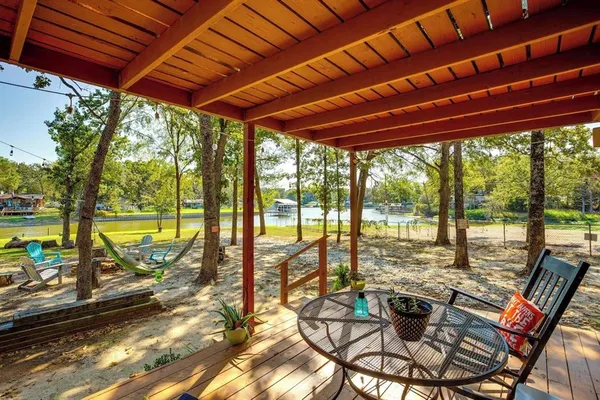 a view of swimming pool with outdoor seating
