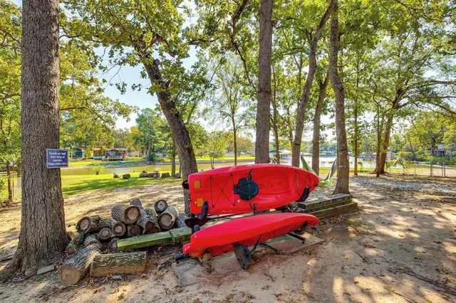 a view of a yard with furniture and trees