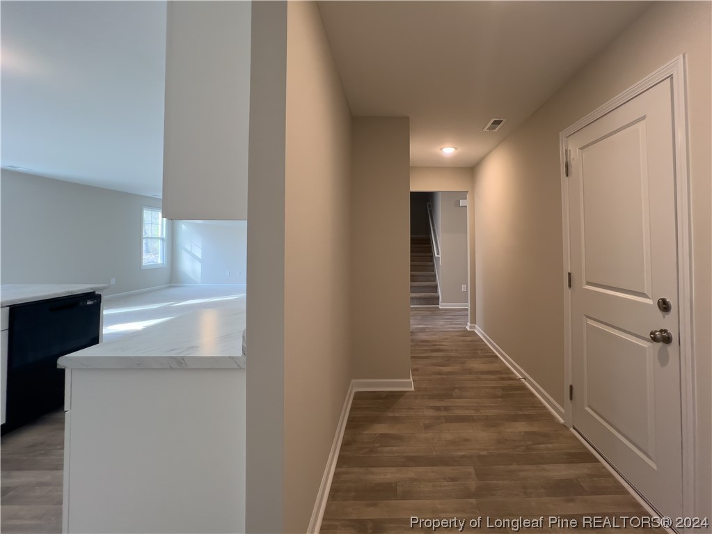 30 Pointer (lot 2) Way Parkton, NC 28371 - Photo 11 of 26 a view of a hallway to an entryway with wooden floor