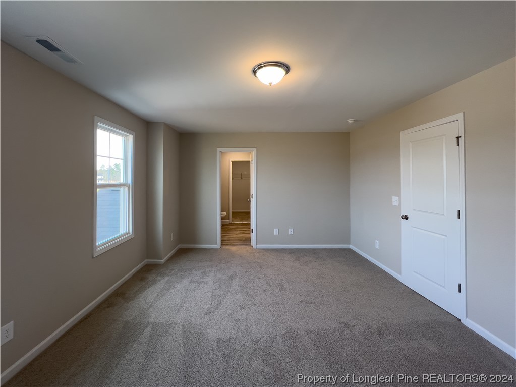 30 Pointer (lot 2) Way Parkton, NC 28371 - Photo 13 of 26 a view of an empty room with window and bathroom