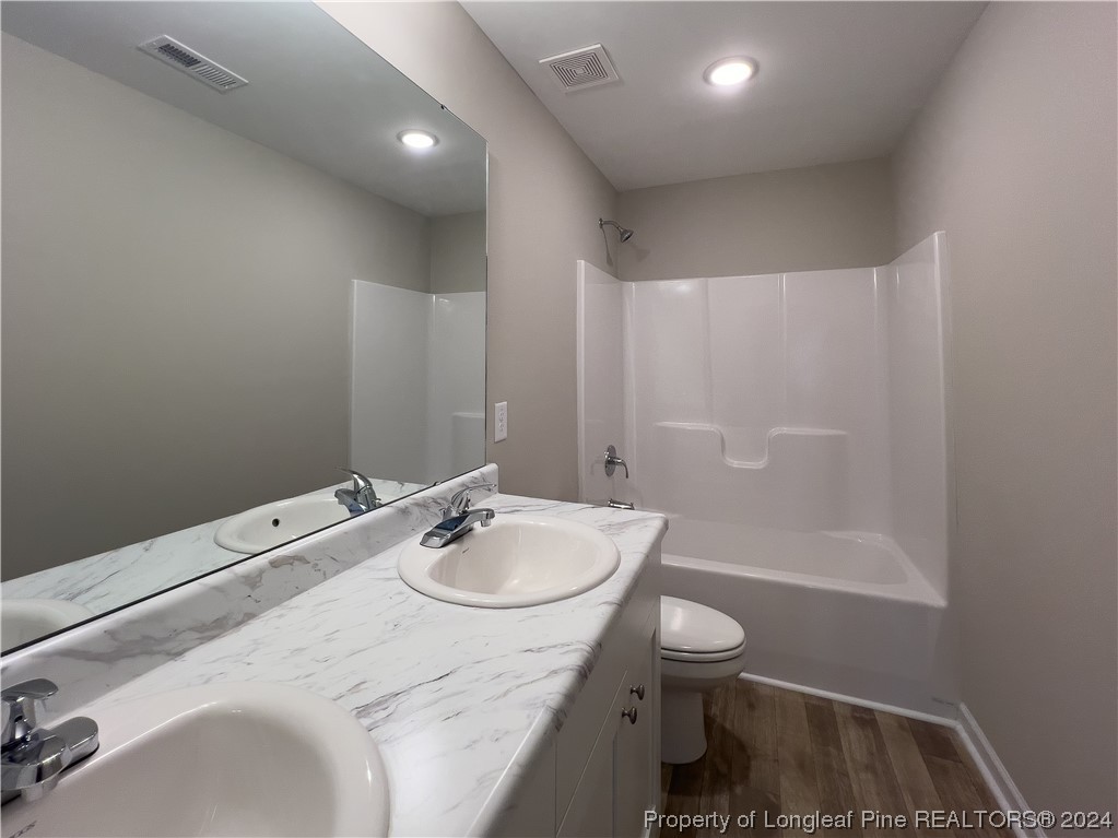 30 Pointer (lot 2) Way Parkton, NC 28371 - Photo 21 of 26 a bathroom with a sink a toilet and shower