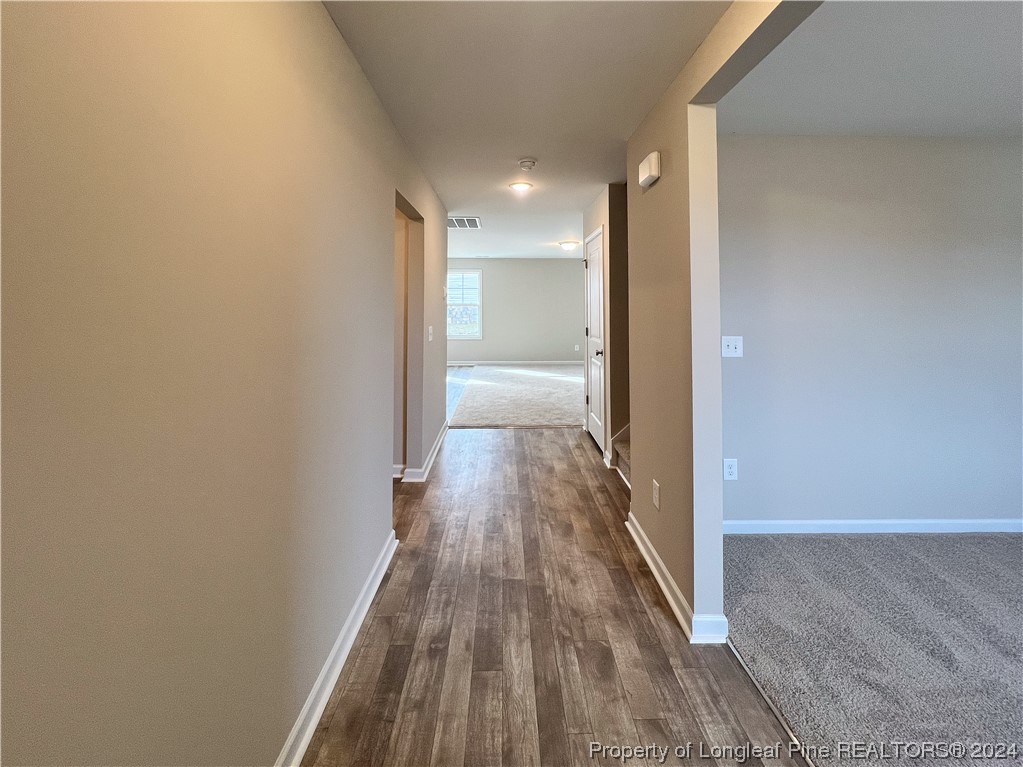 30 Pointer (lot 2) Way Parkton, NC 28371 - Photo 4 of 26 a view of a hallway with wooden floor