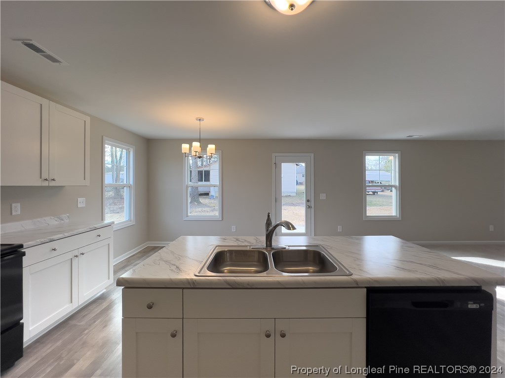 30 Pointer (lot 2) Way Parkton, NC 28371 - Photo 9 of 26 a kitchen with a sink cabinets and window