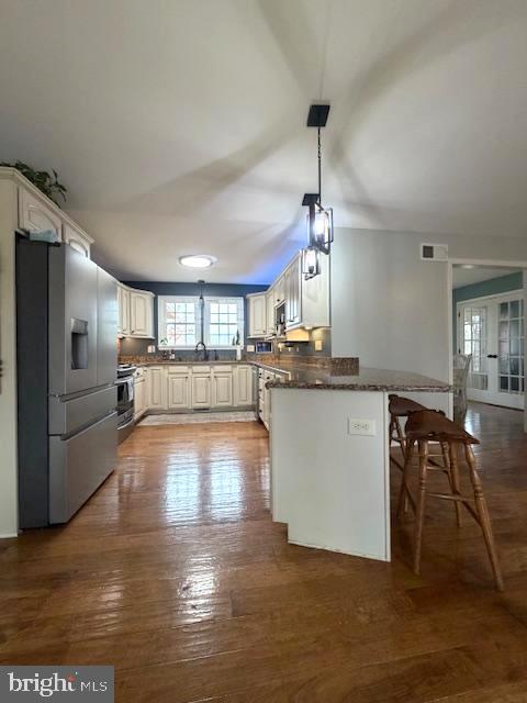 1156 Providence Church Road Hedgesville, WV 25427 - Photo 26 of 101 a view of a kitchen and dining room with wooden floor