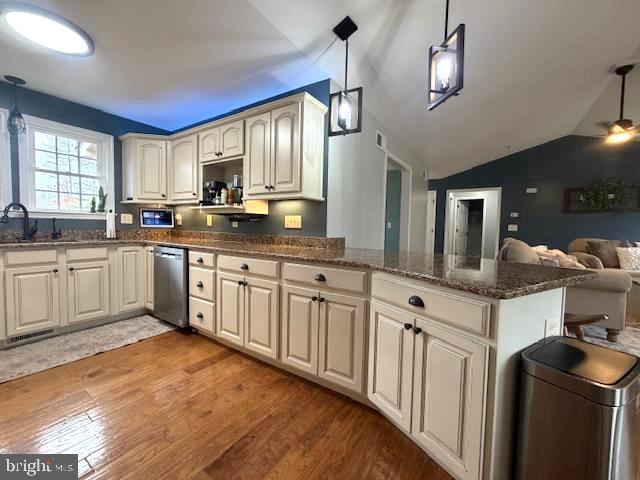 1156 Providence Church Road Hedgesville, WV 25427 - Photo 31 of 101 a kitchen with stainless steel appliances granite countertop a sink and dishwasher a stove with wooden floor