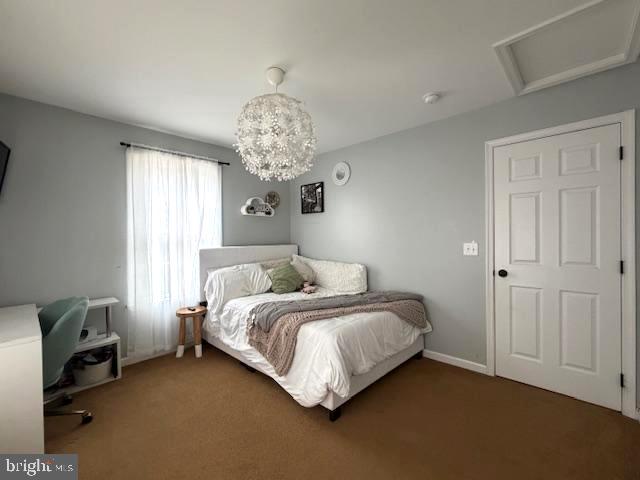 1156 Providence Church Road Hedgesville, WV 25427 - Photo 49 of 101 a bedroom with a bed and a chandelier