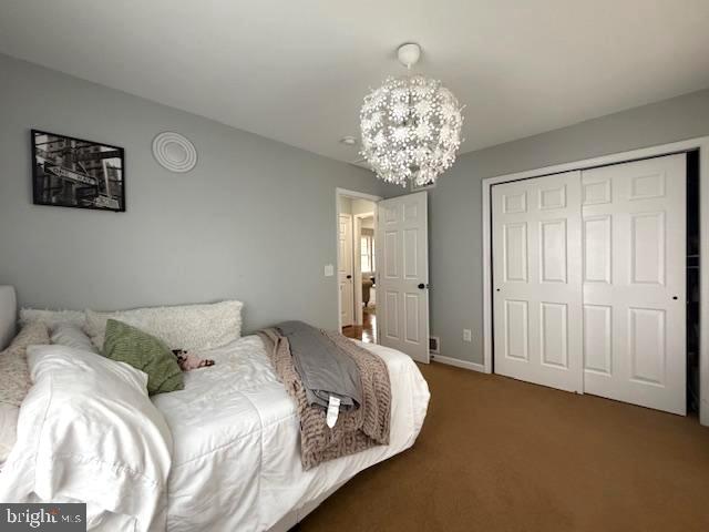 1156 Providence Church Road Hedgesville, WV 25427 - Photo 50 of 101 a bedroom with a bed and a chandelier
