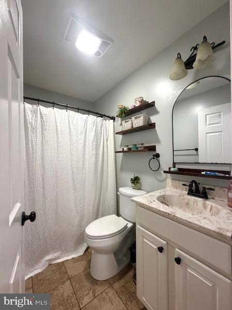 1156 Providence Church Road Hedgesville, WV 25427 - Photo 51 of 101 a bathroom with a granite countertop sink toilet and mirror