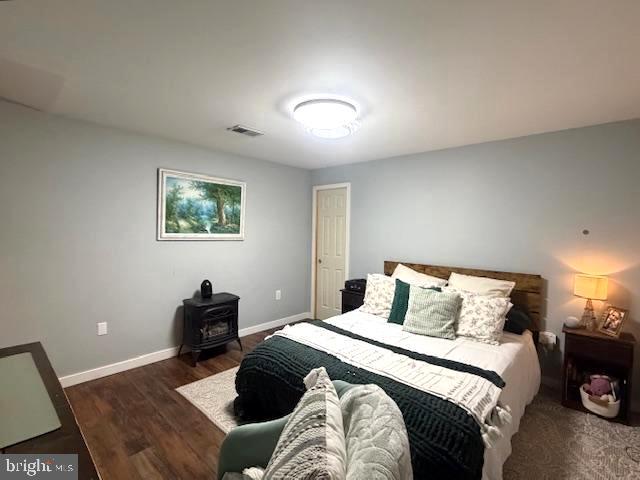 1156 Providence Church Road Hedgesville, WV 25427 - Photo 56 of 101 a bedroom with a bed and a lamp on dresser