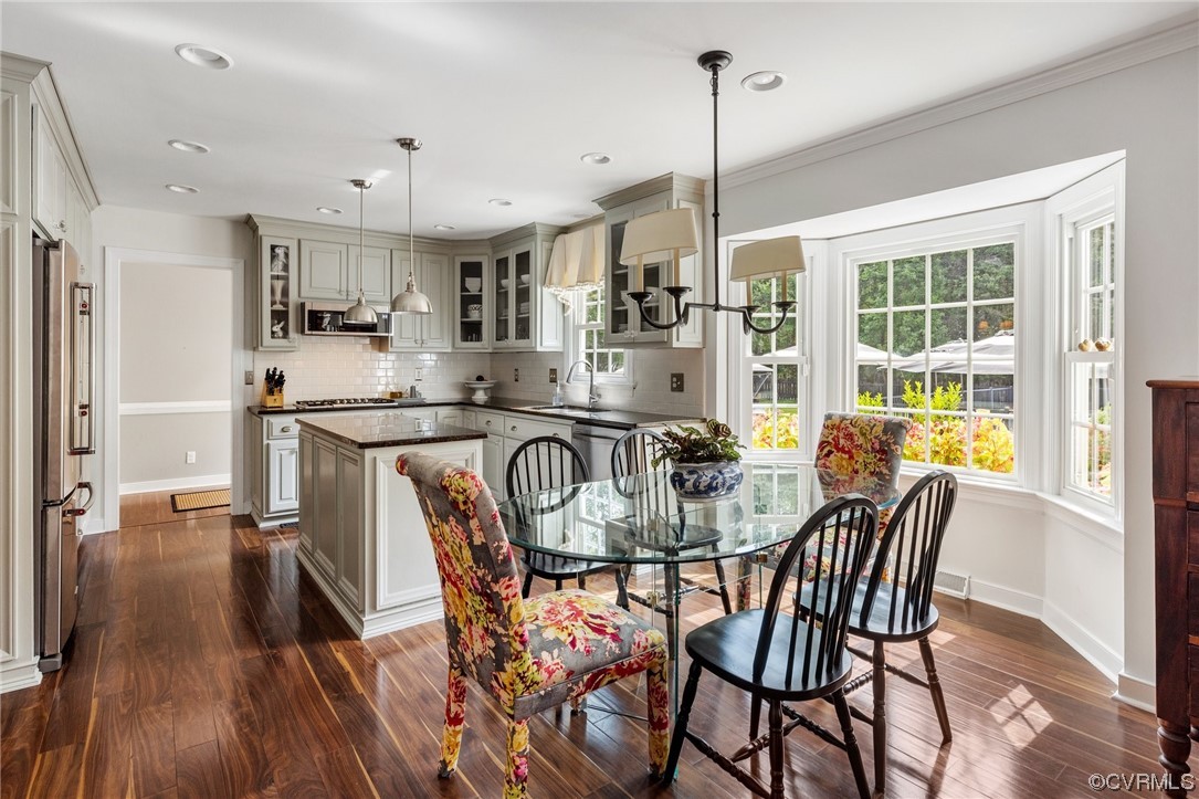 2921 Barrow Place Midlothian, VA 23113 - Photo 11 of 41 a view of a dining room and livingroom with furniture wooden floor a chandelier