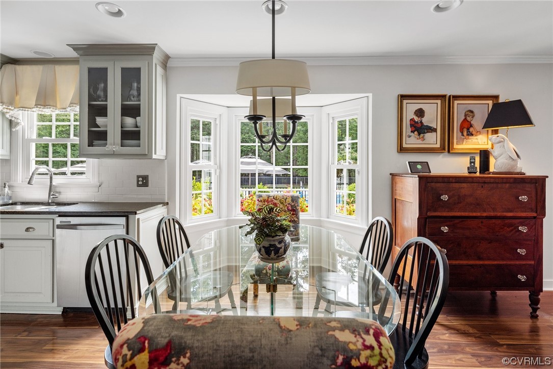 2921 Barrow Place Midlothian, VA 23113 - Photo 12 of 41 a dining room with furniture a chandelier and wooden floor