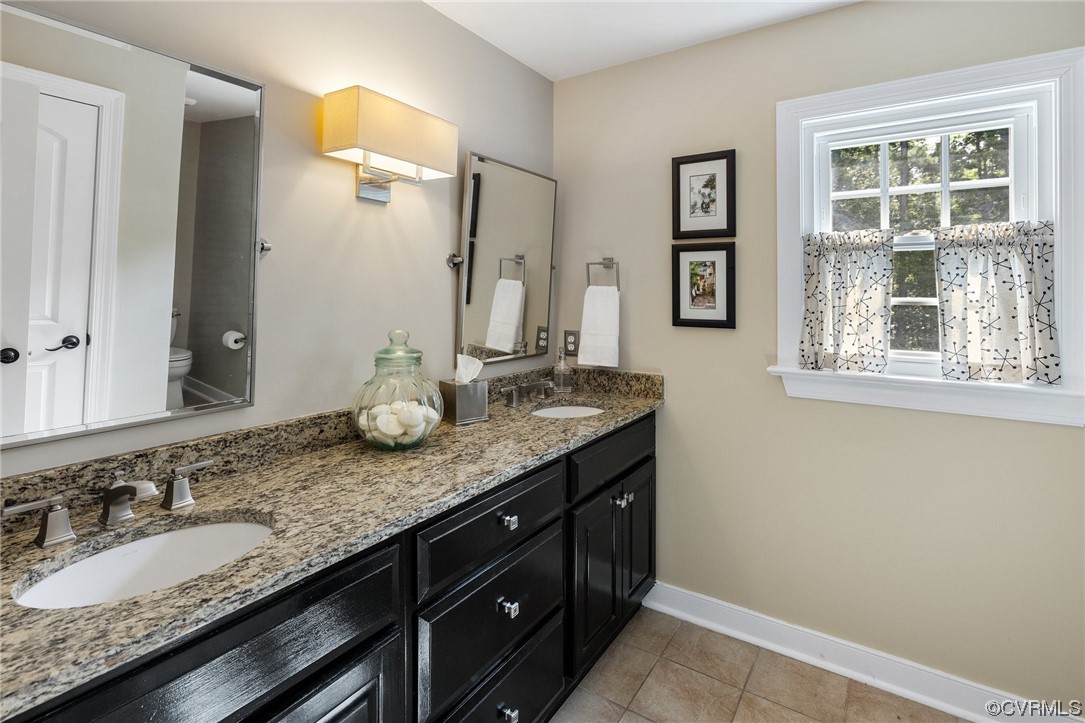 2921 Barrow Place Midlothian, VA 23113 - Photo 22 of 41 a bathroom with a granite countertop sink and a mirror