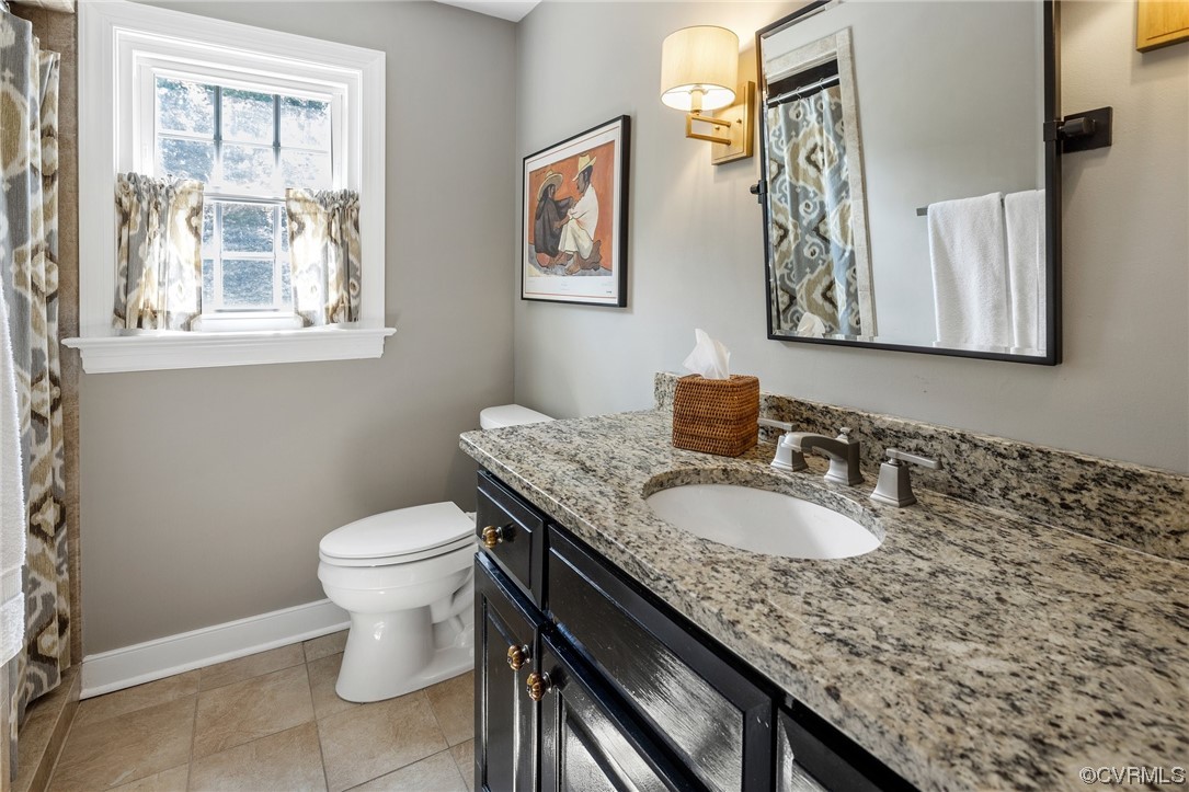 2921 Barrow Place Midlothian, VA 23113 - Photo 25 of 41 a bathroom with a granite countertop toilet sink and mirror