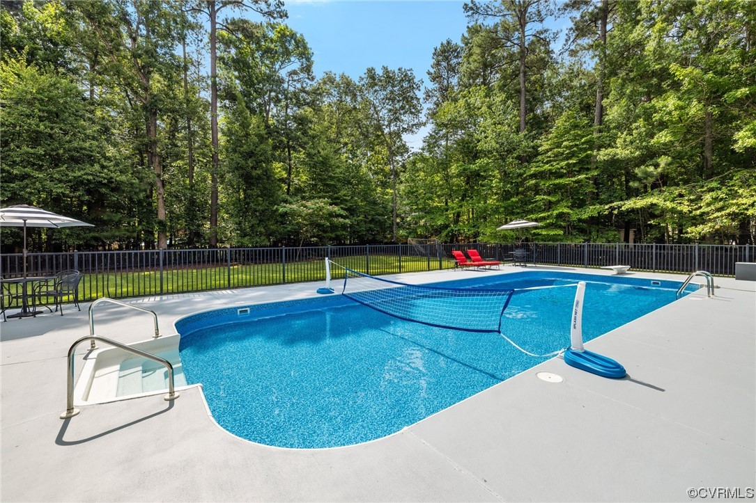 2921 Barrow Place Midlothian, VA 23113 - Photo 34 of 41 a view of a swimming pool with a lounge chairs
