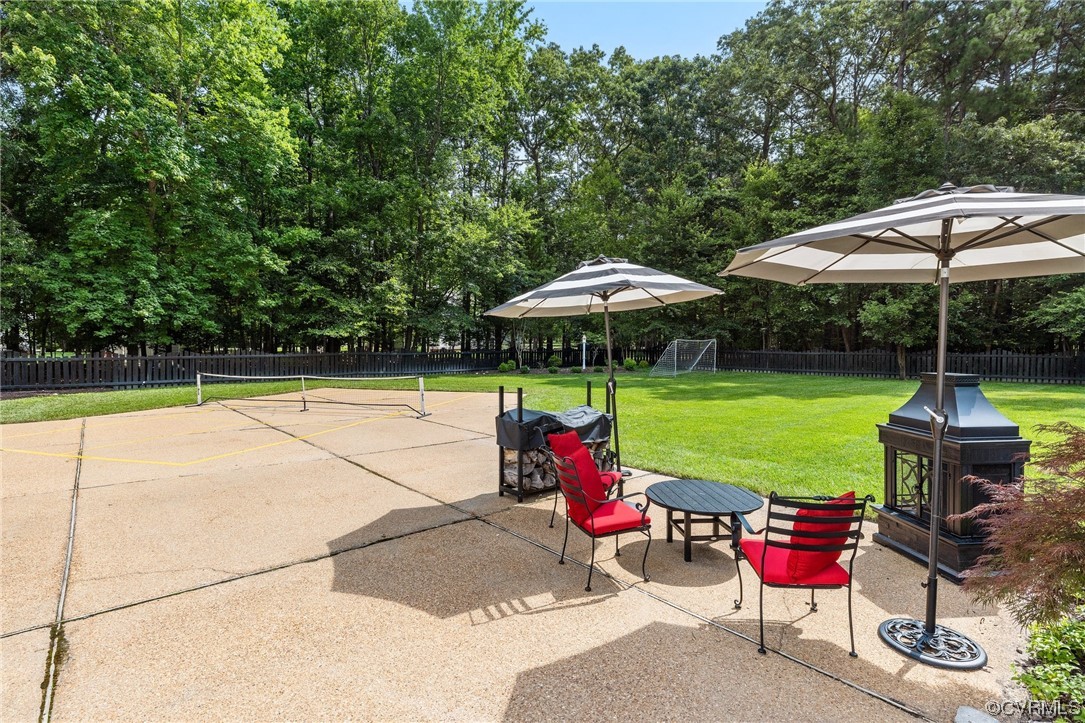 2921 Barrow Place Midlothian, VA 23113 - Photo 38 of 41 a view of a table and chairs under an umbrella