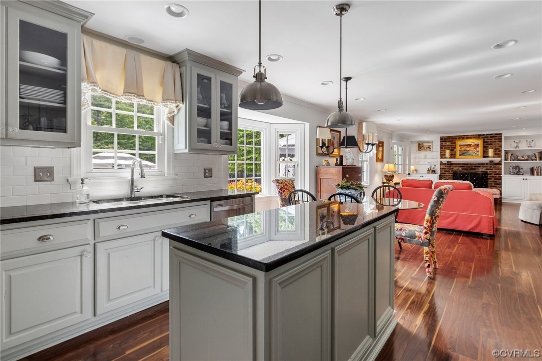 2921 Barrow Place Midlothian, VA 23113 - Photo 7 of 41 a kitchen with stainless steel appliances granite countertop a sink and wooden floor