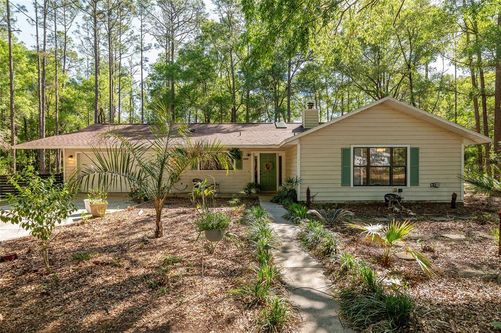 9917 Southwest 77 Court Gainesville, FL 32608 - Photo 28 of 28 a backyard of a house with yard and outdoor seating