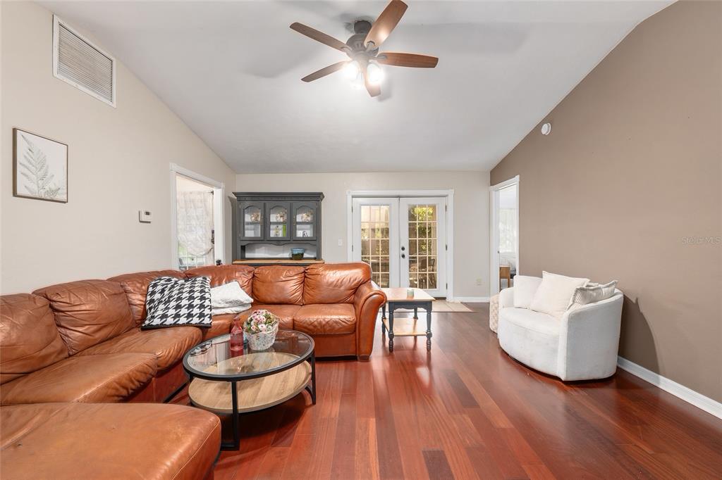 9917 Southwest 77 Court Gainesville, FL 32608 - Photo 3 of 28 a living room with furniture and wooden floor