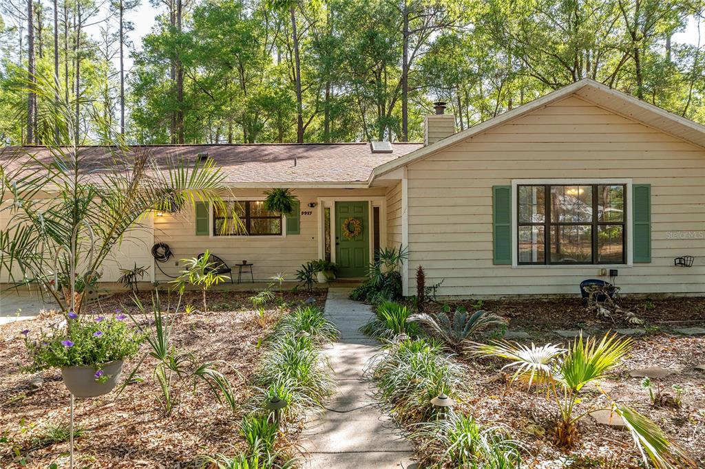 9917 Southwest 77 Court Gainesville, FL 32608 - Photo 8 of 28 a front view of a house with a yard