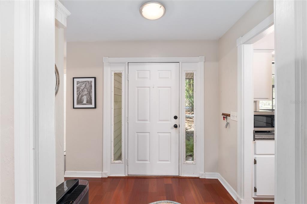 9917 Southwest 77 Court Gainesville, FL 32608 - Photo 10 of 28 wooden floor with window