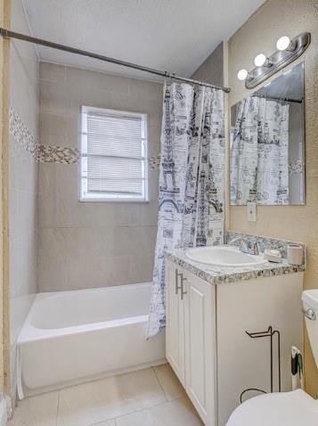 1105 West 34th Street Riviera Beach, FL 33404 - Photo 8 of 15 a bathroom with a granite countertop sink a toilet a mirror a bathtub and shower