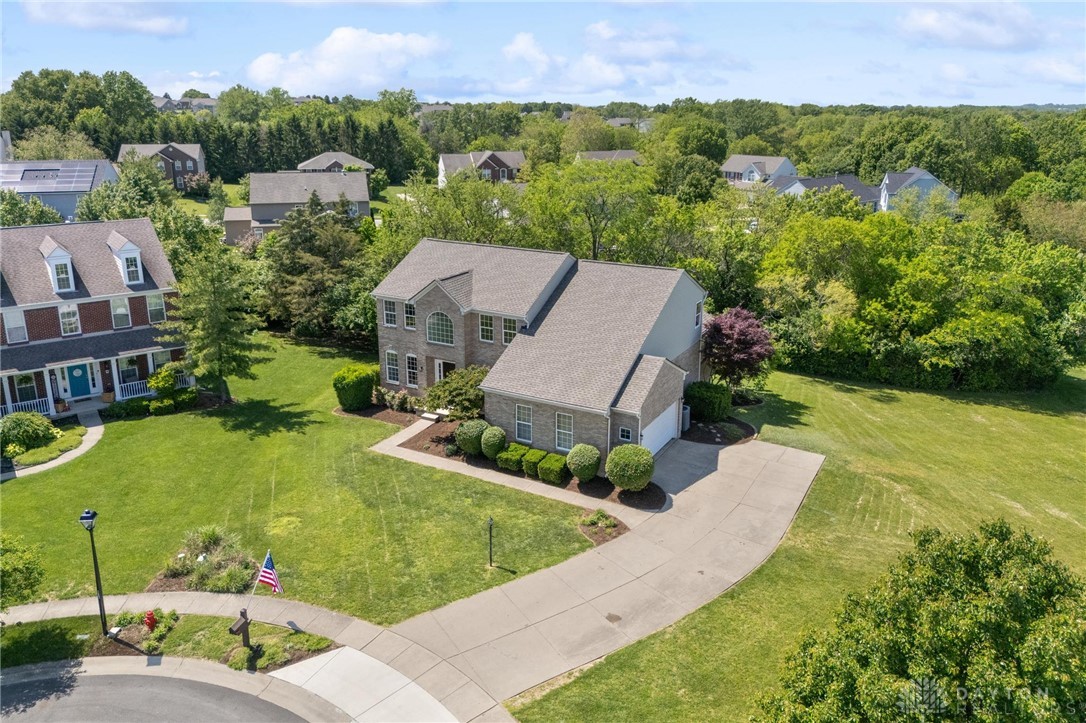 70 Martin Lane Springboro, OH 45066 - Photo 61 of 69 This grand residence features a timeless brick exterior and an expansive, manicured lawn.