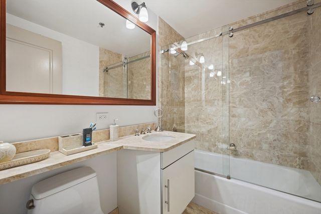 a hallway with furniture and wooden floor