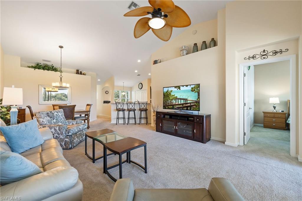 9209 Spring Run Boulevard, Unit 2003 Estero, FL 34135 - Photo 11 of 32 a living room with furniture and a flat screen tv