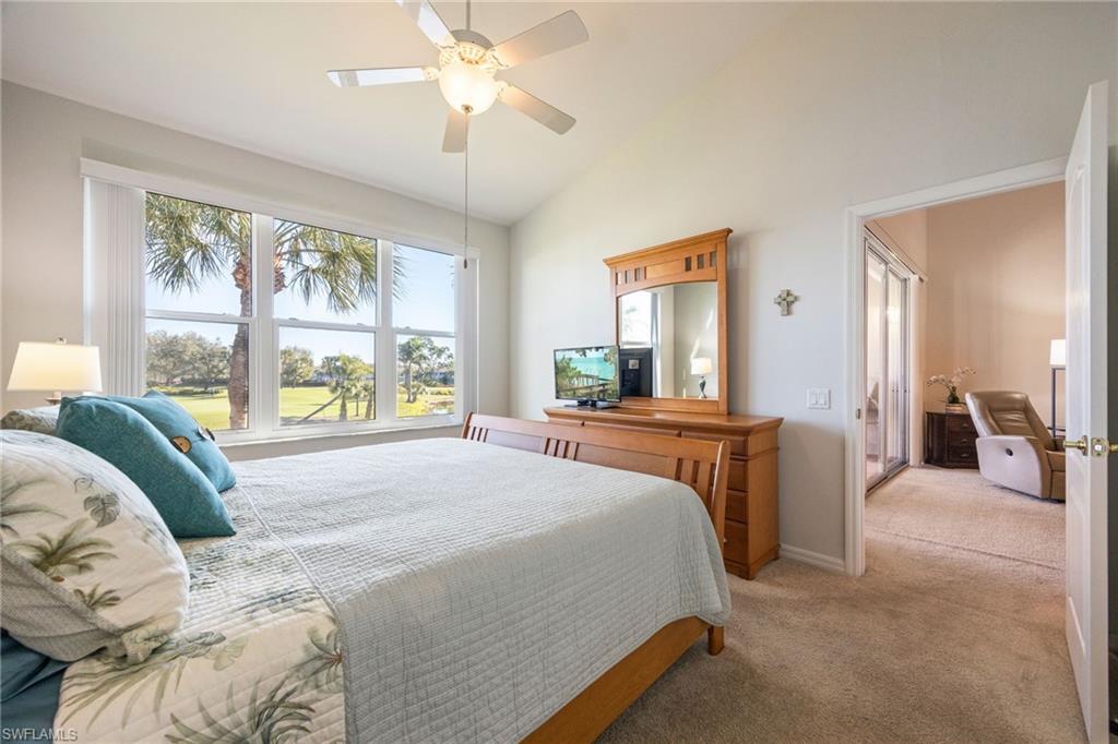 9209 Spring Run Boulevard, Unit 2003 Estero, FL 34135 - Photo 12 of 32 a bedroom with a large bed and a large window