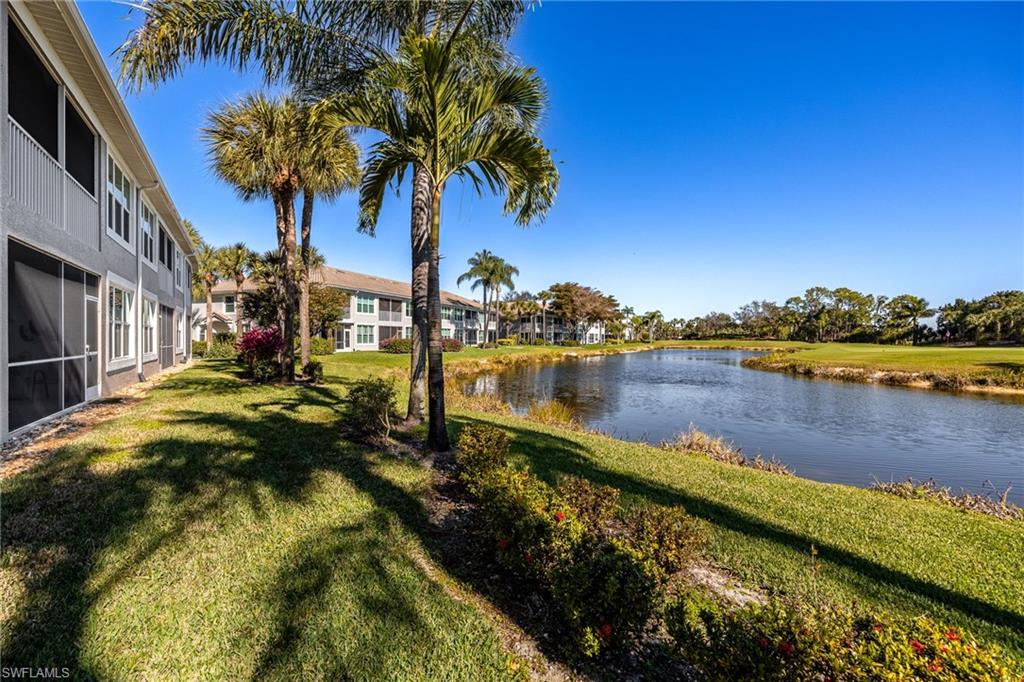 9209 Spring Run Boulevard, Unit 2003 Estero, FL 34135 - Photo 21 of 32 a view of a lake with houses