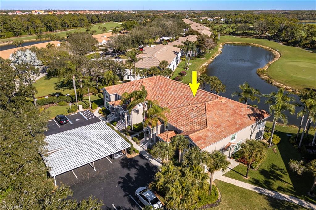 9209 Spring Run Boulevard, Unit 2003 Estero, FL 34135 - Photo 23 of 32 an aerial view of residential houses with outdoor space