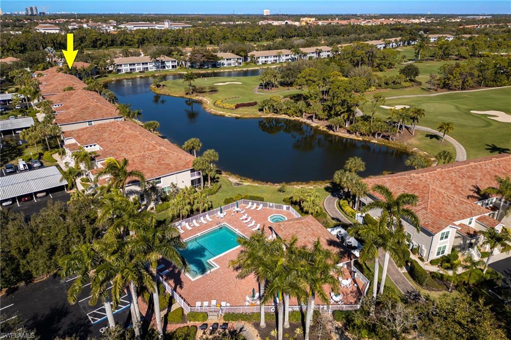 9209 Spring Run Boulevard, Unit 2003 Estero, FL 34135 - Photo 29 of 32 an aerial view of ocean and residential houses with outdoor space