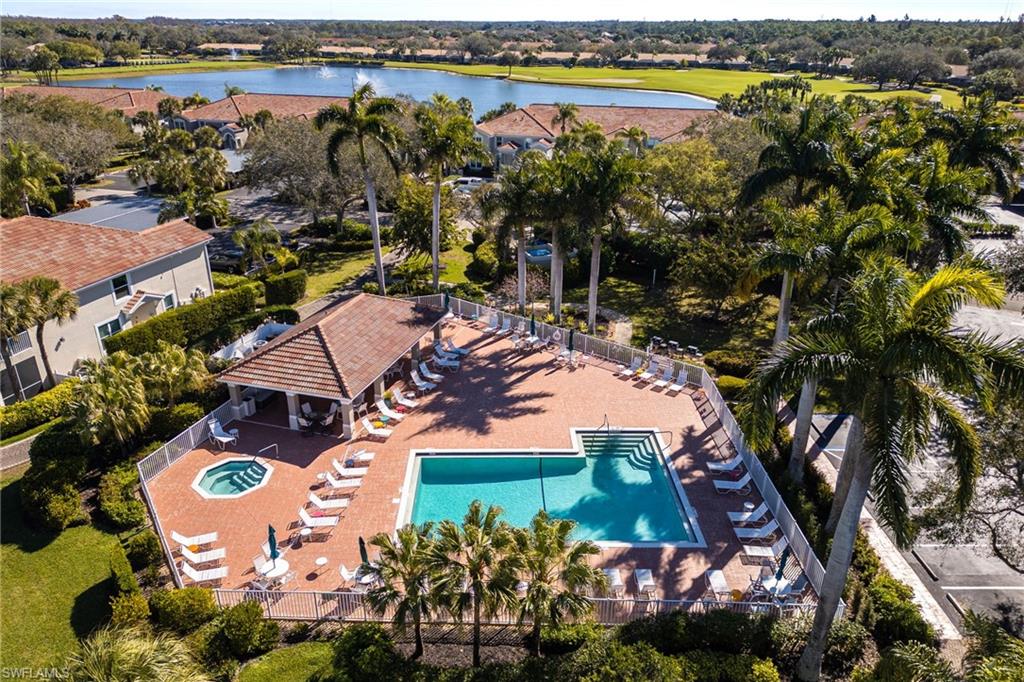 9209 Spring Run Boulevard, Unit 2003 Estero, FL 34135 - Photo 31 of 32 an aerial view of residential houses with outdoor space and swimming pool
