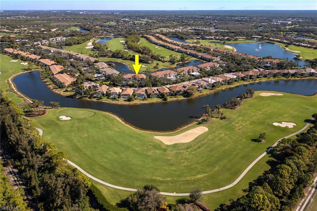 9209 Spring Run Boulevard, Unit 2003 Estero, FL 34135 - Photo 32 of 32 an aerial view of residential houses with outdoor space
