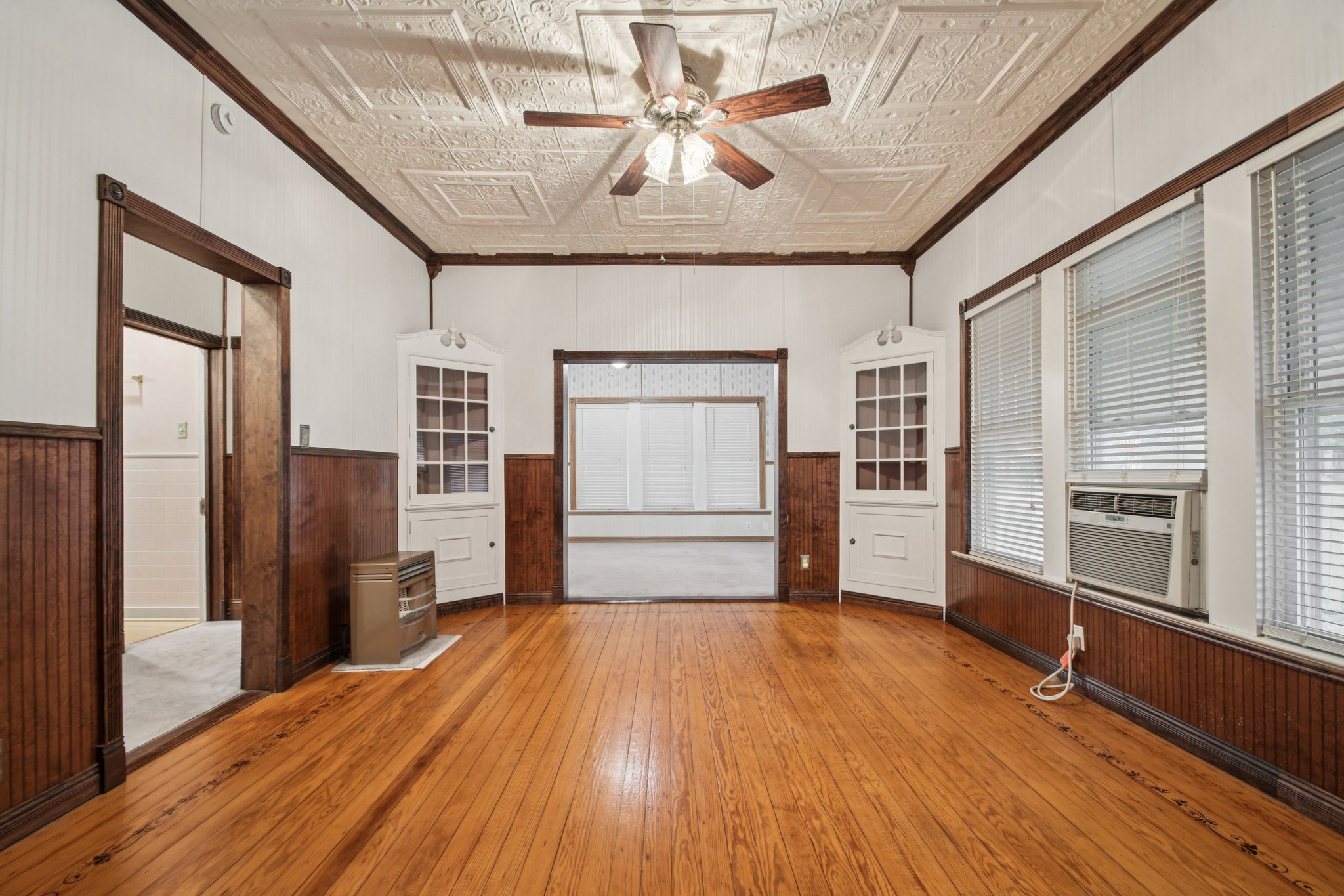 611 North Main Street Elgin, TX 78621 - Photo 11 of 26 a view of livingroom with hardwood floor and a ceiling fan