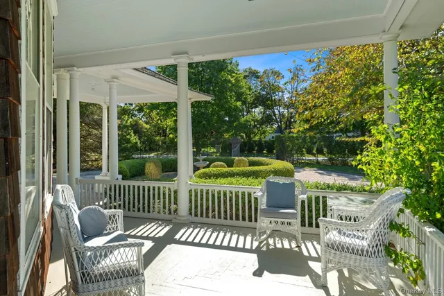a view of a chair and table in the balcony
